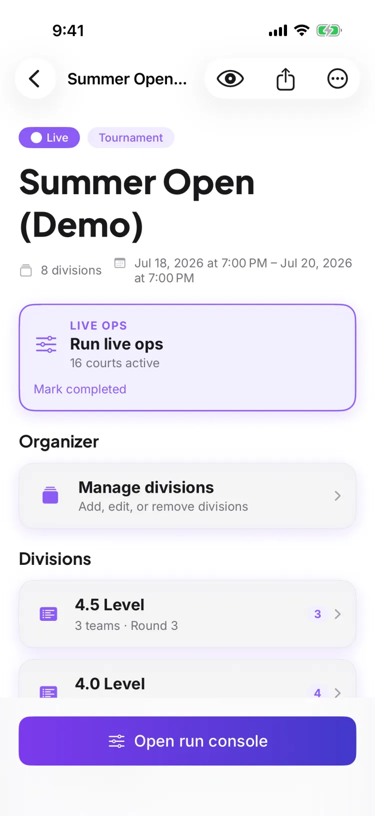 A tournament's Competition Hub — the organizer's home base with live ops, Manage divisions, and the division list